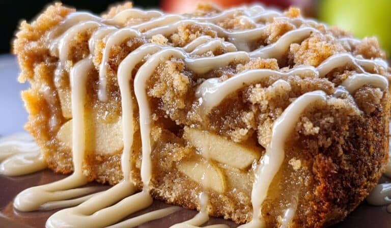 Apple Crumb Cake slice with rich cinnamon crumb and vanilla glaze