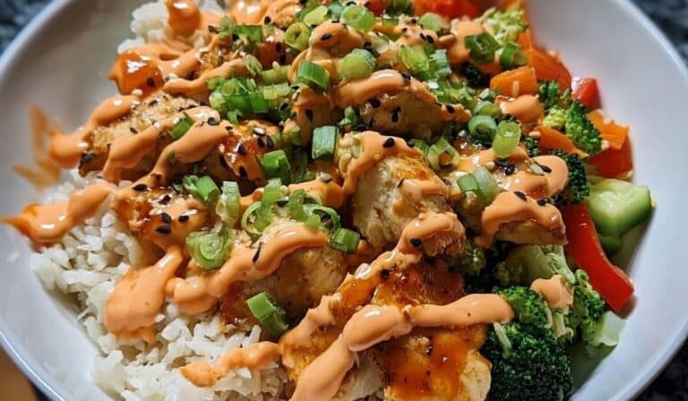 Bang Bang Chicken Bowl with crispy chicken, vegetables, and spicy creamy sauce over rice