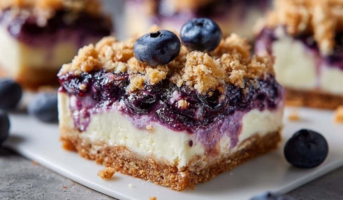 Blueberry Bars with Cheesecake topped with fresh blueberries and crumble