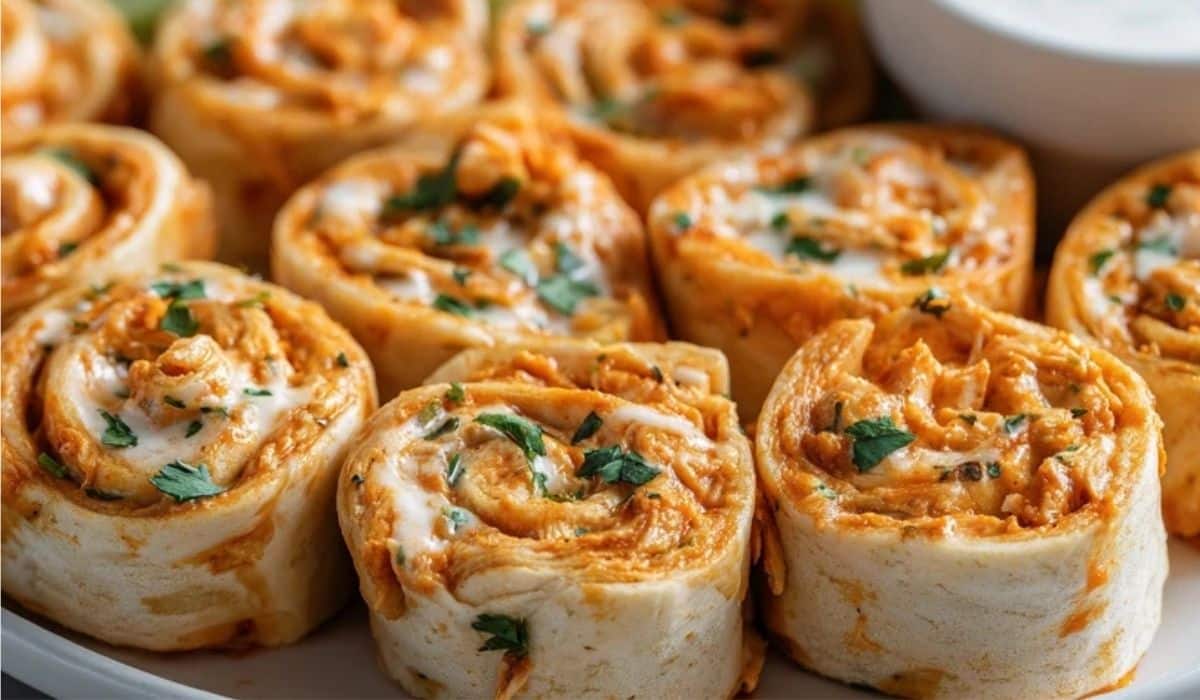 Buffalo Chicken Pinwheels neatly rolled and served with ranch dip