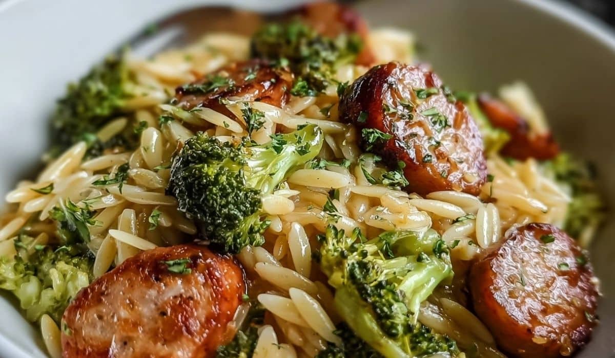 Chicken Sausage Broccoli Orzo in a bowl with golden sausage and green broccoli