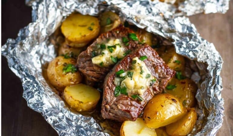 Garlic Butter Steak and Potato Foil Packets with juicy steak and golden potatoes in foil