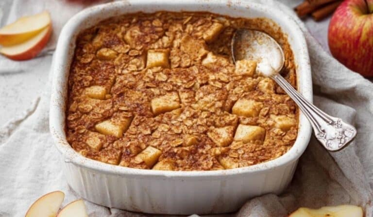 Apple Cinnamon Oatmeal Bake in white ceramic dish fresh from the oven