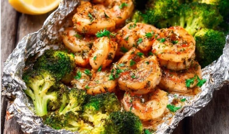 Baked Shrimp and Broccoli Foil Packs served with lemon slices