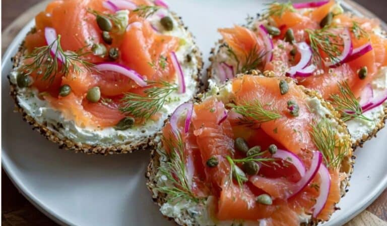 : Smoked Salmon Bagel with Cream Cheese on everything bagel with red onion, dill, and capers