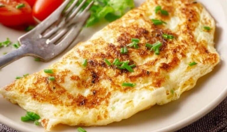 Cheese Egg White Omelette on a plate with fresh herbs