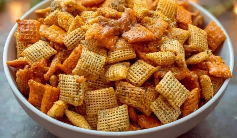 Cheesy Ranch Chex Mix Recipe in a bowl with golden crunchy texture