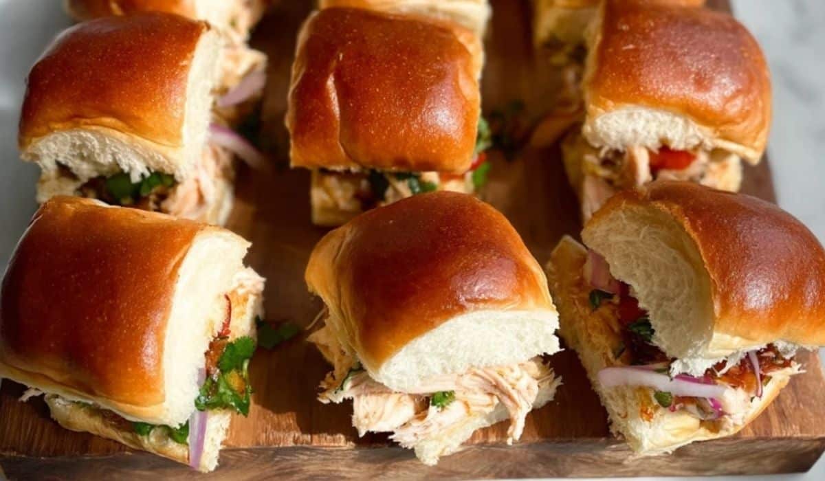 Chicken Sliders with Hawaiian Rolls served on wooden board