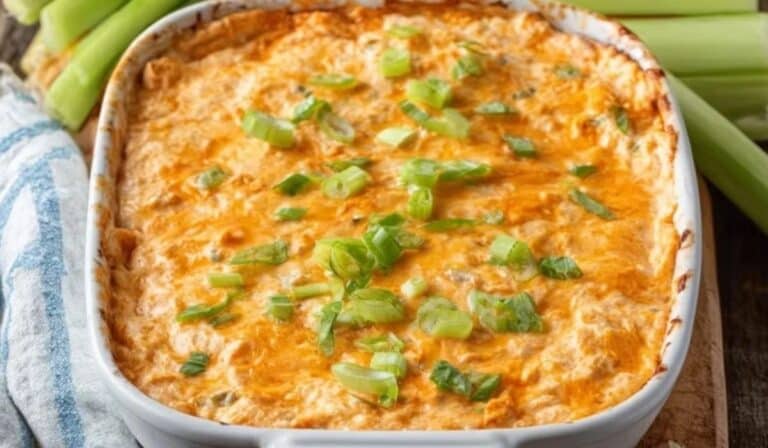 Cottage Cheese Buffalo Chicken Dip baked golden and topped with scallions