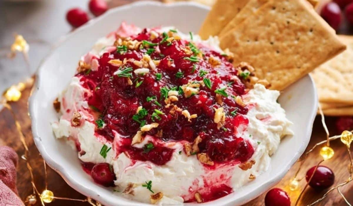 Irresistible Cranberry Cream Cheese Dip with crackers served on a festive plate
