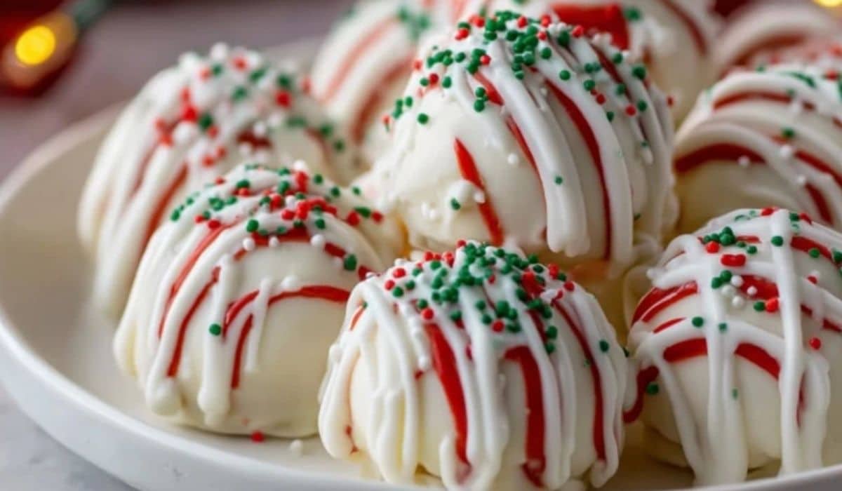 The Best Little Debbie Christmas Tree Cake Truffles on white plate with red drizzle and green sprinkles