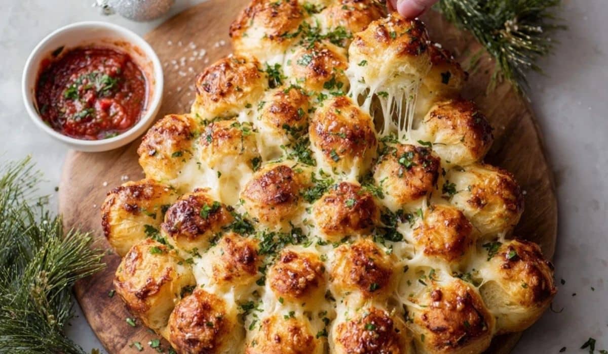Cheesy Pull-Apart Christmas Tree Bread served on a festive holiday table