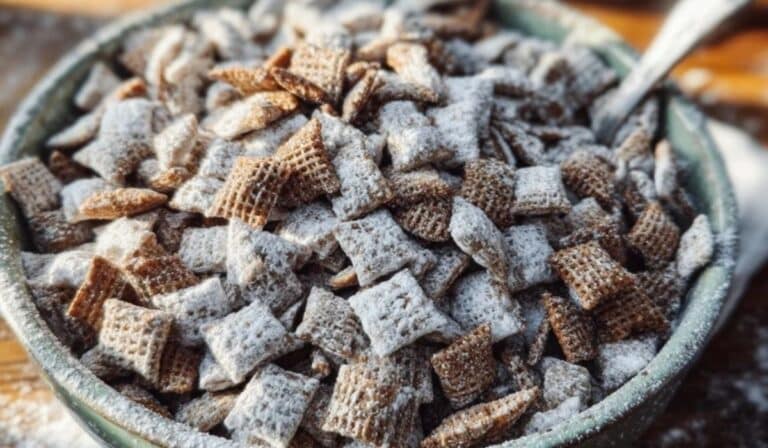 Chex Mix Puppy Chow served in a bowl on a rustic table