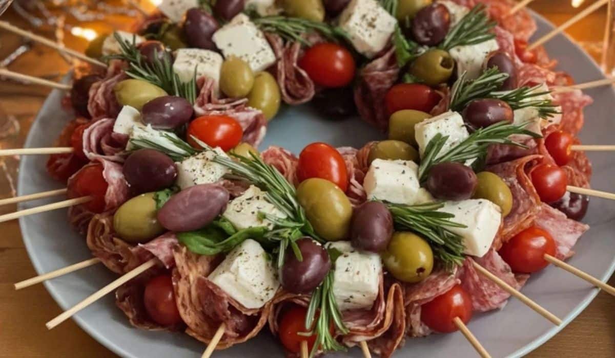 Christmas Antipasto Wreath with olives, cheese, and salami skewers