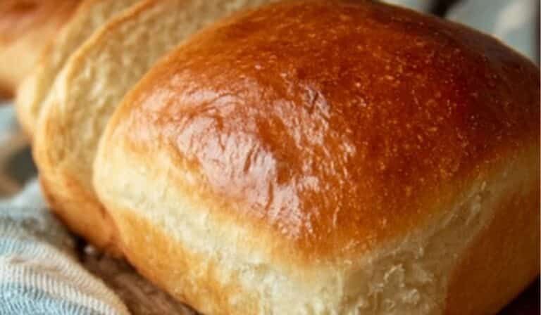 No-Fail Amish White Bread sliced on rustic wooden board