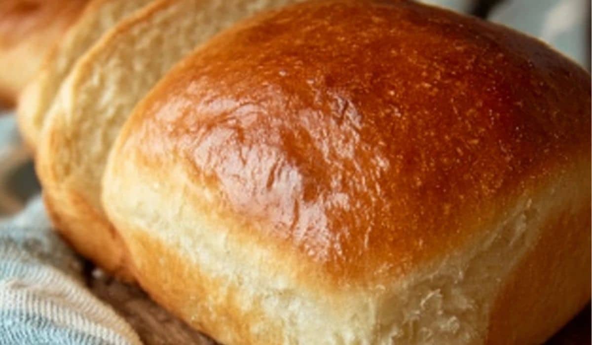 No-Fail Amish White Bread sliced on rustic wooden board