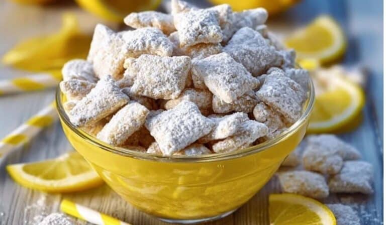 Zesty Lemonade Puppy Chow Snack served in a glass bowl for summer gatherings