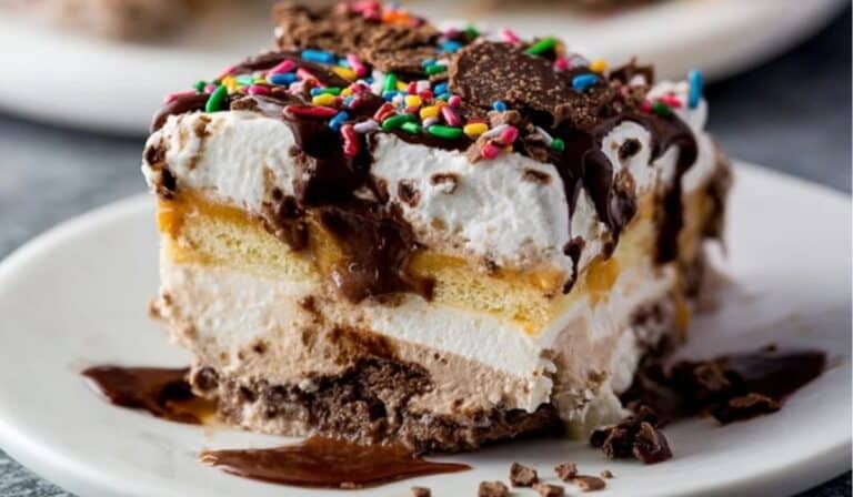 Easy 5 Layer Ice Cream Cake sliced on white marble plate