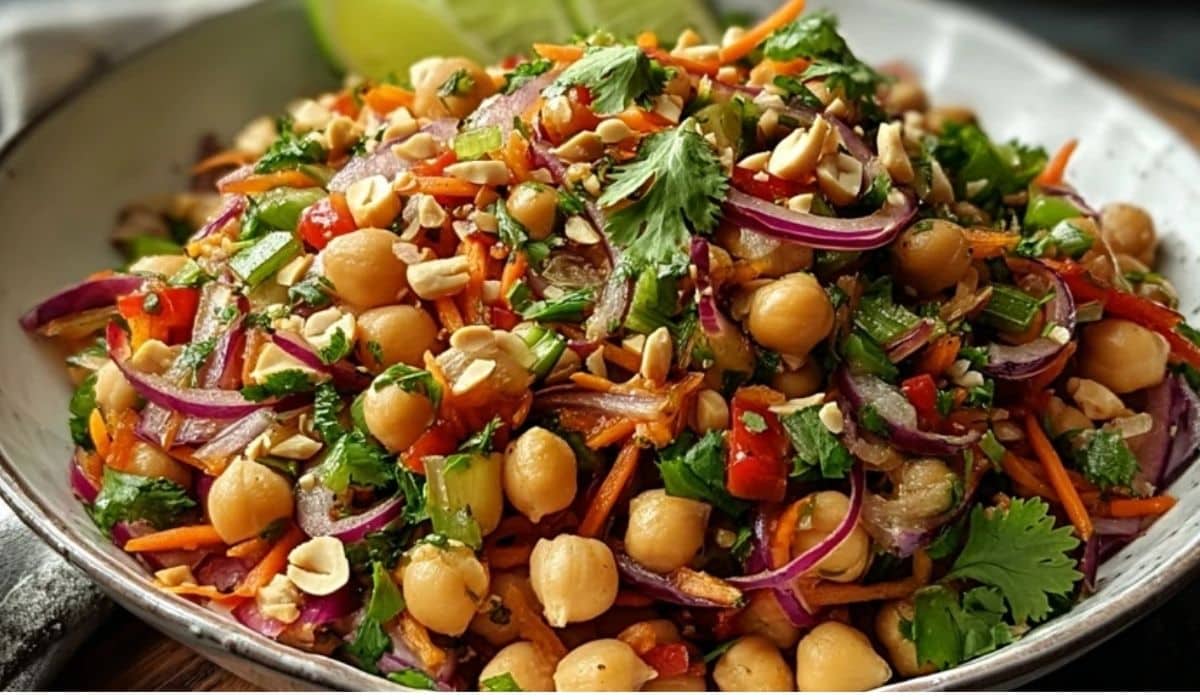 Crunchy Thai Chickpea Salad served in bowl with lime and peanuts