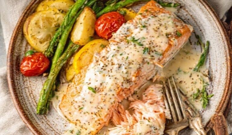 Easy Baked Boursin Salmon on ceramic plate with vegetables