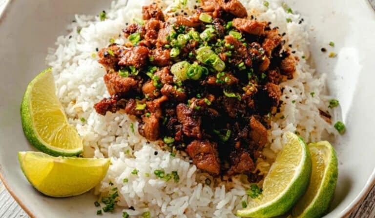 Easy Ginger Lime Pork with Coconut Rice beautifully plated on a modern white dish