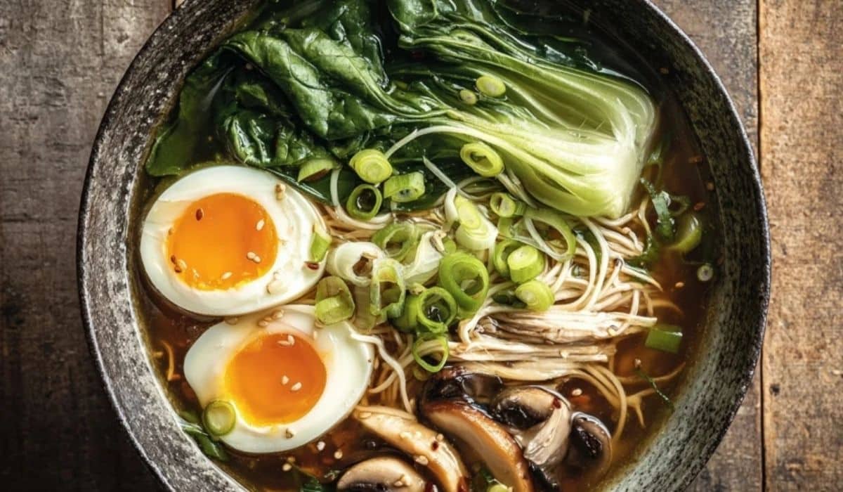 Gut-healing bone broth ramen in a cozy bowl with egg, bok choy, and mushrooms